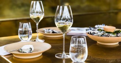 RIEDEL Veritas Champagne glasses filled with Champagne on a set tabletop.